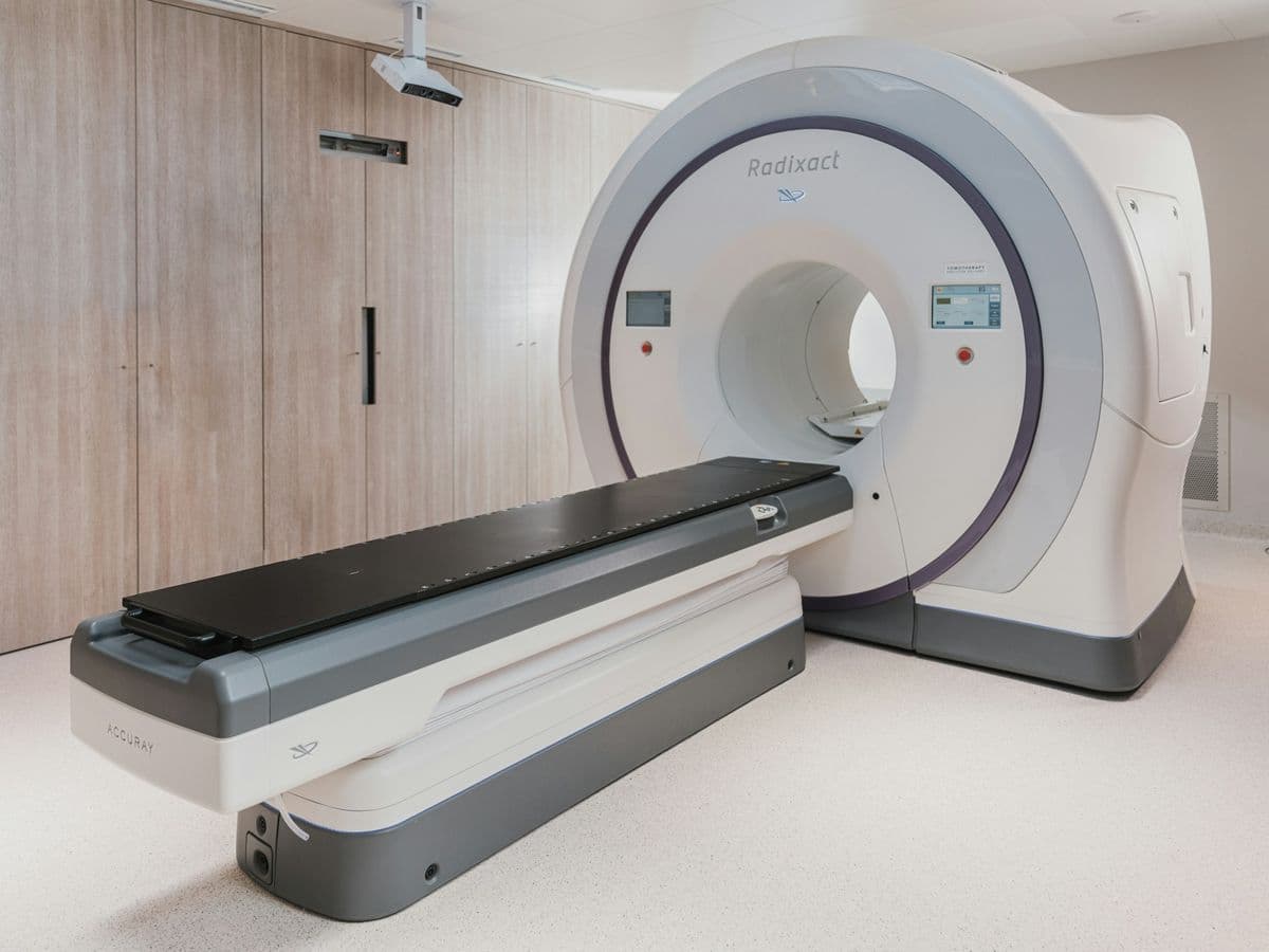 Bright diagnostic imaging room with a large scanner and patient table